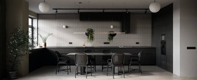 A stylishly decorated kitchen with dark black and gray decor