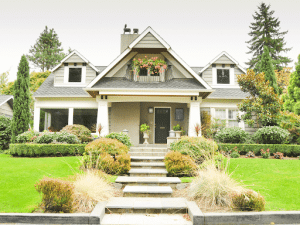 The front yard and steps leading up to a large house